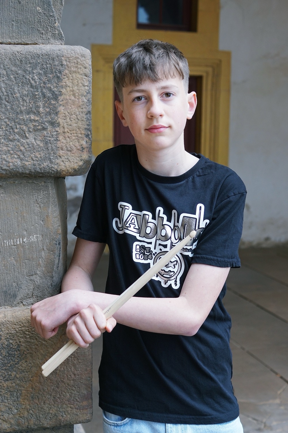Barber 1 young man with beard smiling and wearing a  brown shirt